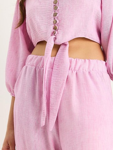 Completo pantalone di Bianco Lucci in rosa