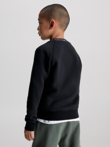 Calvin Klein JeansSweater majica 'Instarsia' - crna boja