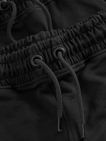 Skinny Pantaloni di Next in nero
