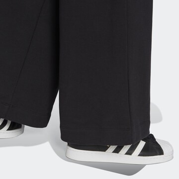 Flared Pantaloni di ADIDAS ORIGINALS in nero