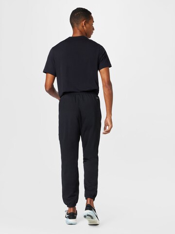 NIKE Tapered Workout Pants in Black