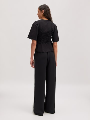 juoda EDITED Marškinėliai 'Edith'