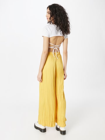 Wide leg Pantaloni di Warehouse in giallo