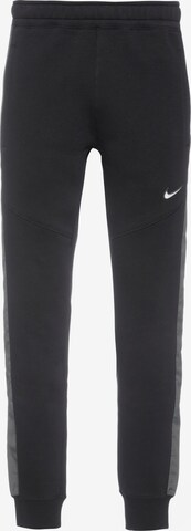 Nike Sportswear Tapered Pants in Black: front