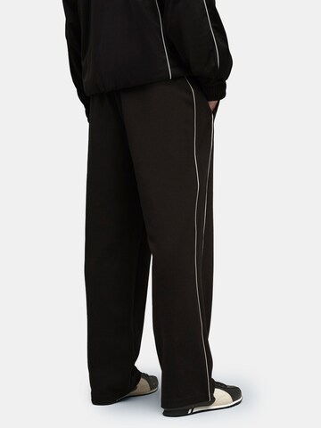 PUMA Regular Sporthose 'T7' in Schwarz