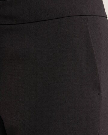 Flared Pantaloni di WE Fashion in nero