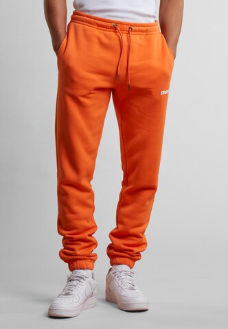 Starter Black Label Tapered Trousers 'Essential' in Orange