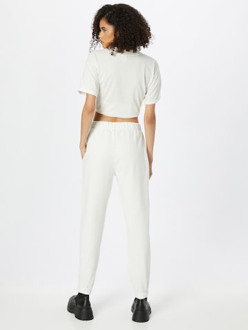 Effilé Pantalon 'Sandra' ABOUT YOU x INNA en blanc