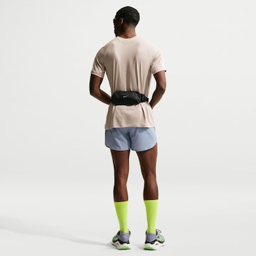 NIKE Regular Workout Pants 'Stride Nvlty' in Purple