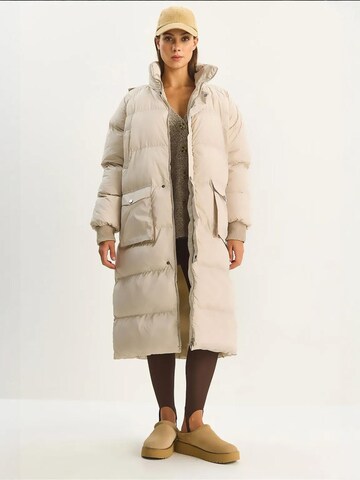 Bianco Lucci Winter Coat in Beige: front
