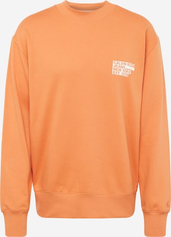Sweat-shirt Calvin Klein Jeans en orange : devant