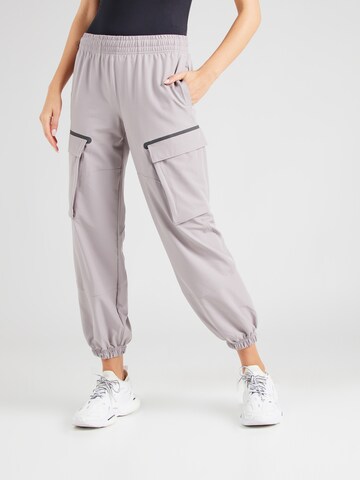 UNDER ARMOUR Tapered Workout Pants 'Unstoppable' in Grey: front