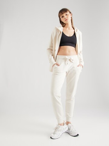 Effilé Pantalon de sport DKNY Performance en beige