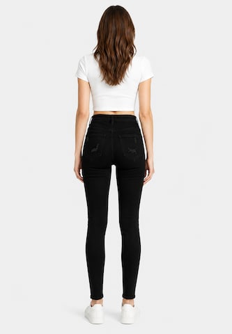 Skinny Jeans di Elara in nero