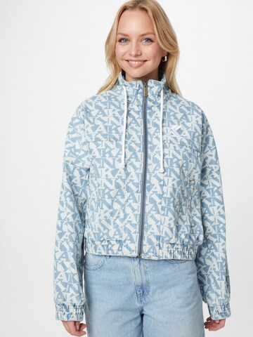 Karl Kani Välikausitakki 'Originals Denim' värissä sininen: etupuoli