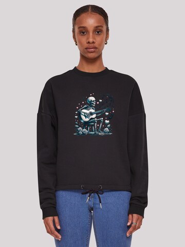 Sweat-shirt 'Skelett spielt Gitarre, Musik, Liebe' F4NT4STIC en noir : devant