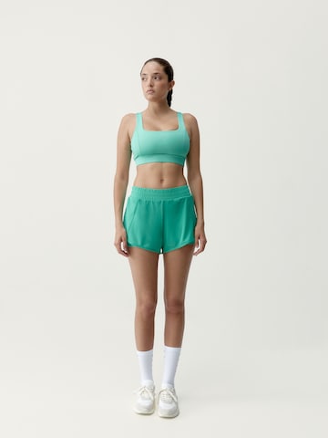 Born Living Yoga Slimfit Sportbroek 'Padma 2.0' in Groen: voorkant