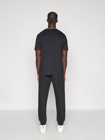 Champion Authentic Athletic Apparel Zwężany krój Spodnie 'Rib Cuff' w kolorze czarny