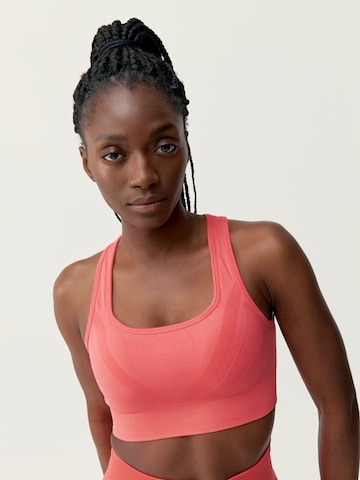 Born Living Yoga Sports Top 'Nish' in Pink: front