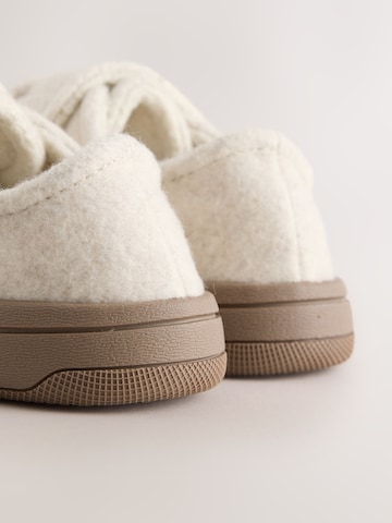 Neonato di Next in beige