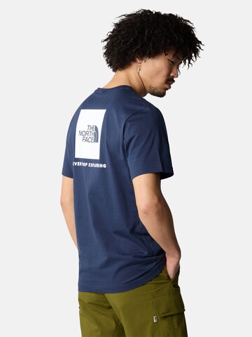 mėlyna THE NORTH FACE Marškinėliai 'Redbox': priekis