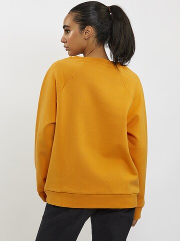 FRESHLIONS Oversized Sweater in Orange