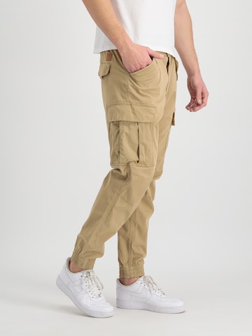 ALPHA INDUSTRIES Tapered Cargo trousers 'Airman' in Beige