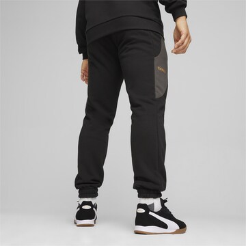 PUMA Tapered Sporthose 'KING' in Schwarz