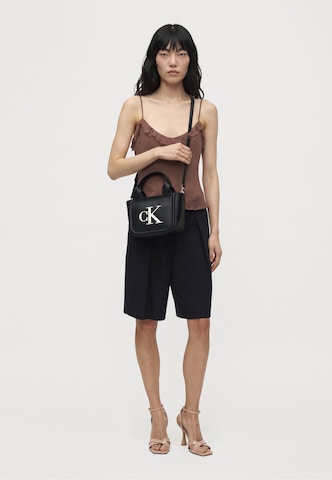 Calvin Klein Käekott 'BOLD', värv must: eest vaates