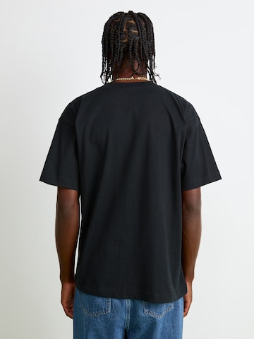 T-Shirt 'Suisio' ELLESSE en noir