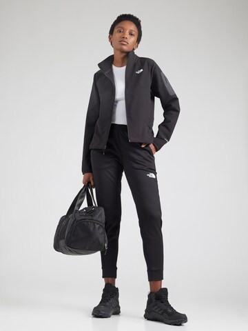THE NORTH FACE - Tapered Pantalón deportivo 'Mountain Athletics' en negro