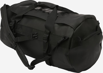 RAINS Travel Bag in Black: front