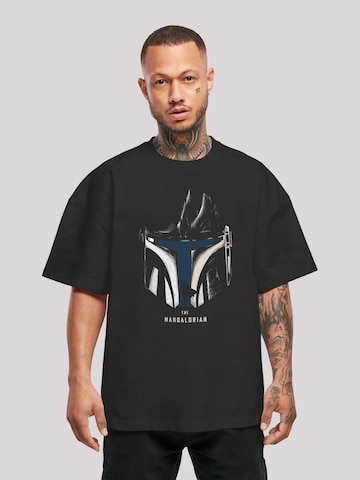 F4NT4STIC Shirt 'Star Wars The Mandalorian Helmet Silhouette' in Zwart: voorkant