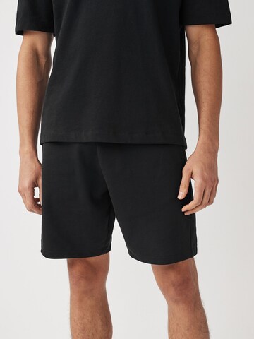 Loosefit Pantaloni di Next in nero: frontale