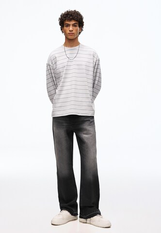 Flared Jeans di Bershka in nero