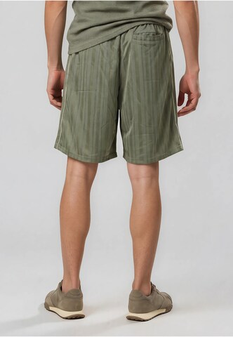 Loosefit Pantaloni di Karl Kani in verde