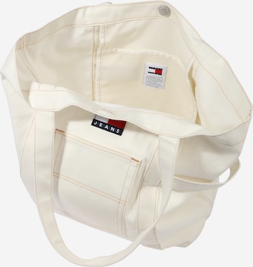 Tommy Jeans Ostoskassi värissä beige