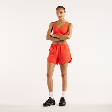 new balance Regular Sports trousers 'RC Essential Short 5"' in Orange