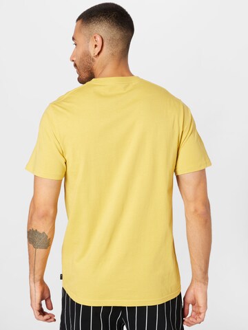 RIP CURL - Camiseta funcional 'REVIVAL VIBRATIONS' en amarillo