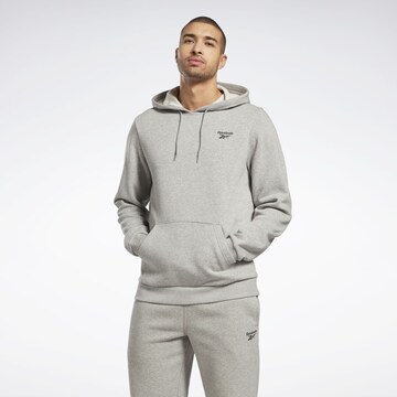 ReebokSportska sweater majica ' Reebok Identity Fleece Over-the-Head Hoodie ' - siva boja