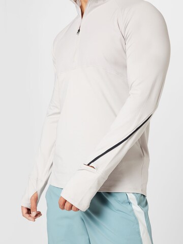 T-Shirt fonctionnel 'Qualifier' UNDER ARMOUR en gris