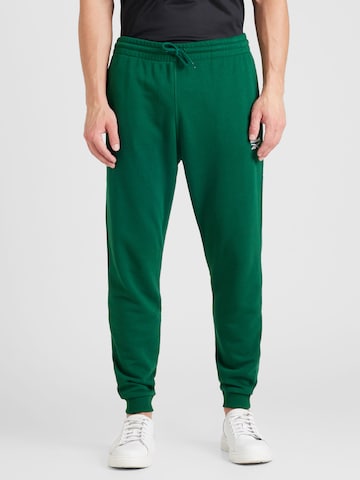 Tapered Pantaloni sport 'IDENTITY' de la Reebok pe verde: față
