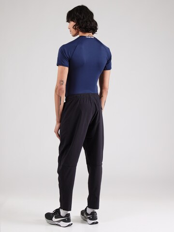 Nike Sportswear Tapered Trousers in Black