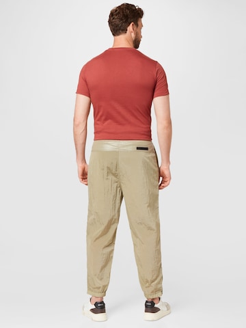 Calvin Klein Jeans Zwężany krój Spodnie w kolorze zielony