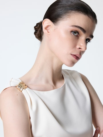 Haut adl en beige