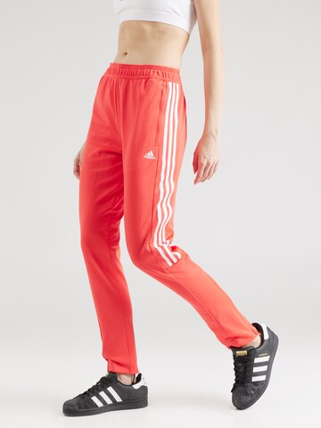 ADIDAS SPORTSWEAR - Slimfit Calças de desporto em laranja: frente