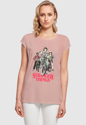 ABSOLUTE CULT Shirt 'Stranger Things - Retro Bikers' in Pink: Vorderseite