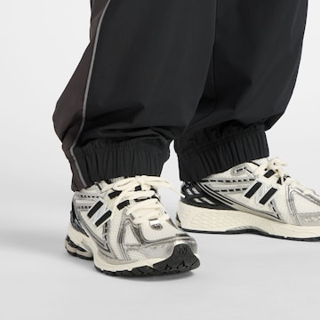new balance Wide Leg Sporthose 'Trackside' in Schwarz