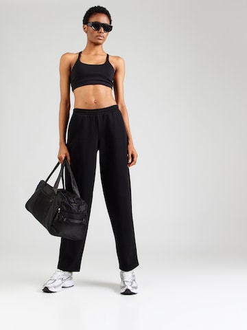 UNDER ARMOUR Regular Workout Pants in Black