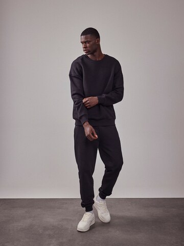 Sweat-shirt 'The Essential' DAN FOX APPAREL en noir